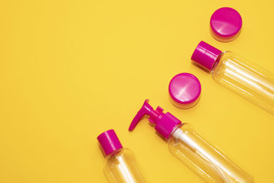 Close-up of bottle against yellow background