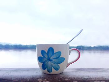 Coffee cup on window sill