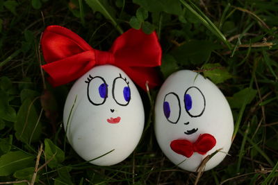 Close-up of red easter eggs in grass