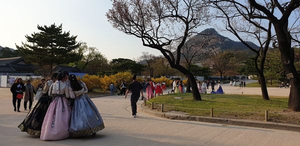 People walking on street in park