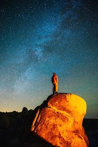 Scenic view of landscape against sky at night