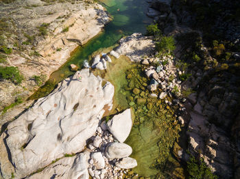 High angle view of river amidst rocks