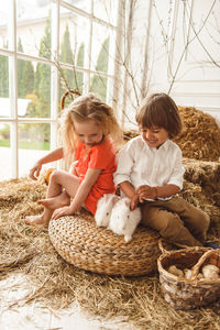 Children at easter with rabbits and ducks