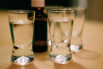 Close-up of drinks in glasses on table
