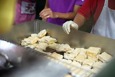 Midsection of person preparing food