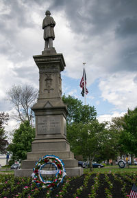 Low angle view of statue against trees