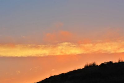 Scenic view of dramatic sky during sunset