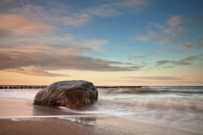 Scenic view of sea against sky at sunset