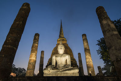 Low angle view of temple against building