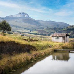 Scenic view of lake and mountains against sky