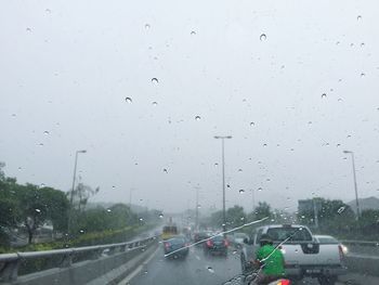 Road seen through wet window