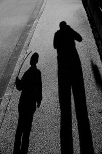 Shadow of silhouette people on wall