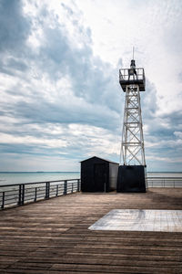 Lighthouse in the wooden pier of the port of cancale.