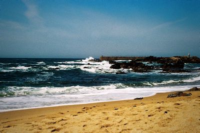 Scenic view of beach against sky