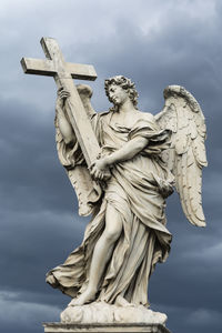 Low angle view of statue against sky