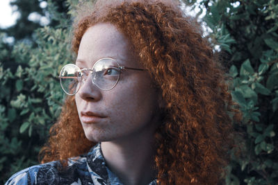 Portrait of a young woman looking away