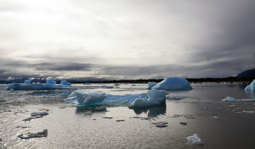 Scenic view of frozen lake against sky