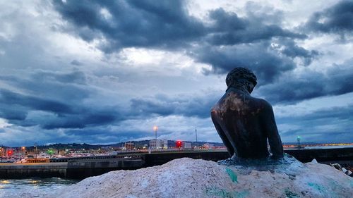 Statue of liberty against cloudy sky