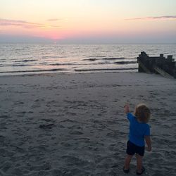 Scenic view of sea at sunset