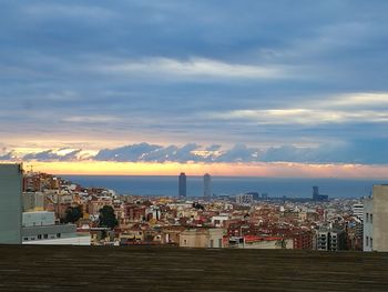 Cityscape against sky during sunset