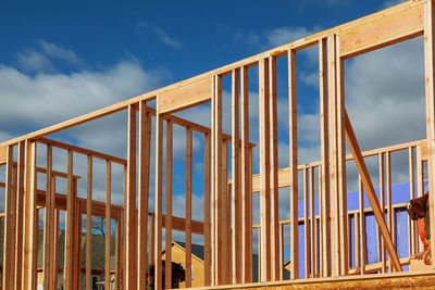 Low angle view of construction site against sky