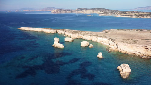 High angle view of rocks on sea shore