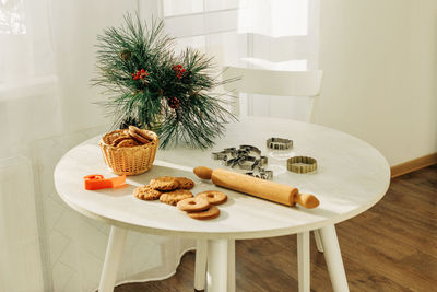 Christmas or new year's pastries on a table decorated with pine branches. christmas, gingerbread