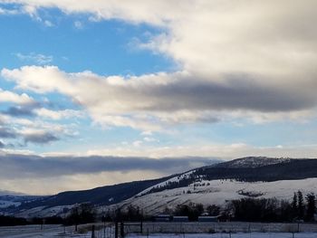 Scenic view of mountains against sky during winter