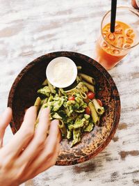 Midsection of person having food on table