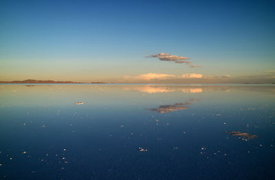 Scenic view of sea against blue sky