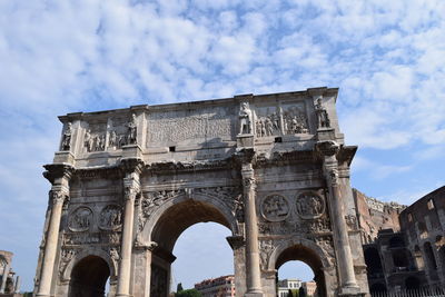 Low angle view of historical building against cloudy sky