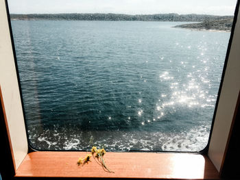 High angle view of sea seen through window