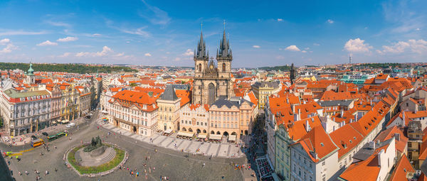 High angle view of buildings in town against sky