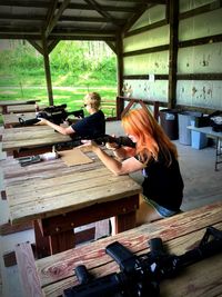 Mother and son target shooting