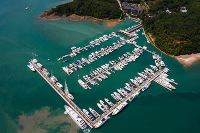 Yachts and boats in marina bay at phuket thailand aerial view