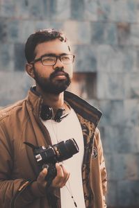 Young man photographing