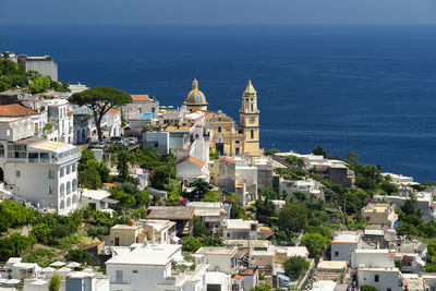 High angle view of townscape by sea