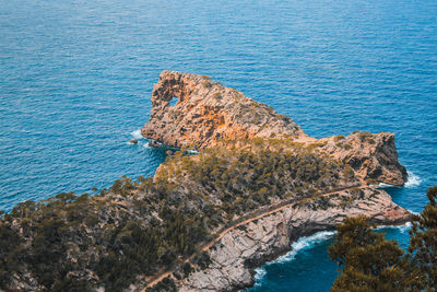 High angle view of rock formation in sea