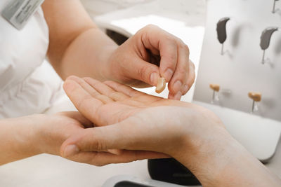 Cropped hands of person working on table