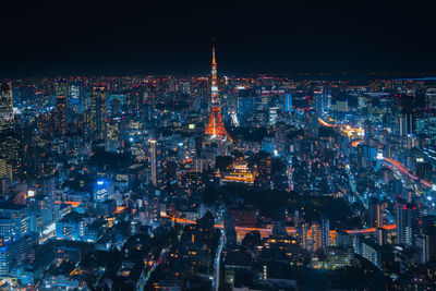 Aerial view of illuminated city at night