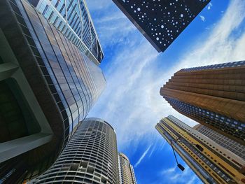 Low angle view of skyscrapers against sky