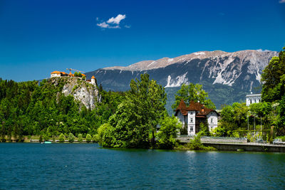 Scenic view of calm lake against mountains