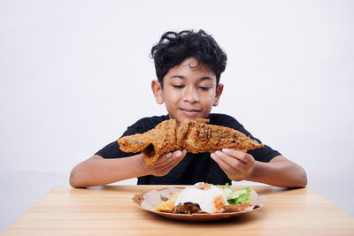 Portrait of cute girl eating food