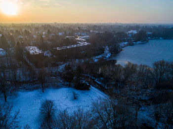 Scenic view of river against sky during winter