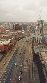 High angle view of city street and buildings against sky