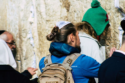 Rear view of couple holding hands