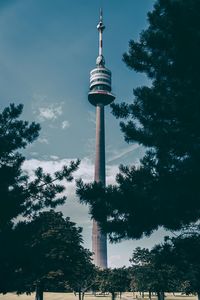 Low angle view of communications tower against sky