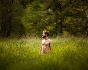 Young man standing on field