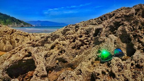 Scenic view of sea against blue sky