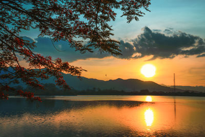 Scenic view of lake against sky during sunset